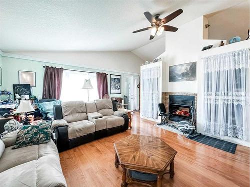 6018 52 Avenue, Stettler, AB - Indoor Photo Showing Living Room With Fireplace