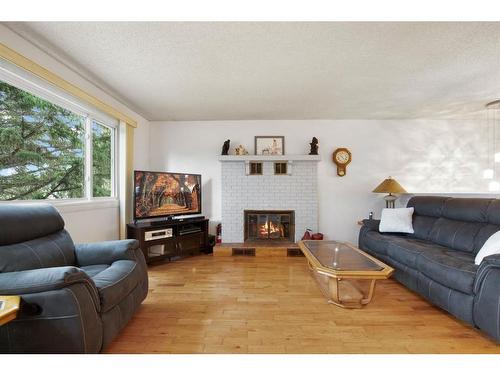 32 Rutherford Drive, Red Deer, AB - Indoor Photo Showing Living Room With Fireplace