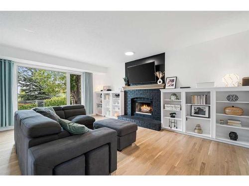 14306 Evergreen Street Sw, Calgary, AB - Indoor Photo Showing Living Room With Fireplace