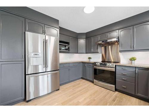 14306 Evergreen Street Sw, Calgary, AB - Indoor Photo Showing Kitchen With Stainless Steel Kitchen With Upgraded Kitchen