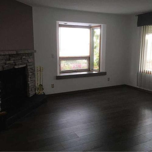 1502 40 Street Se, Calgary, AB - Indoor Photo Showing Other Room With Fireplace