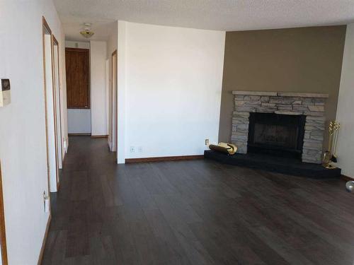 1502 40 Street Se, Calgary, AB - Indoor Photo Showing Living Room With Fireplace