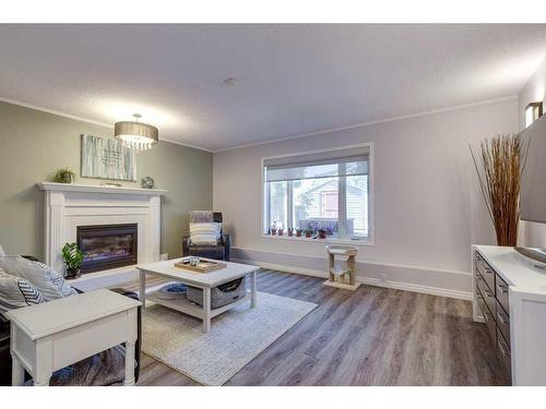 25 Dumas Crescent, Red Deer, AB - Indoor Photo Showing Living Room With Fireplace