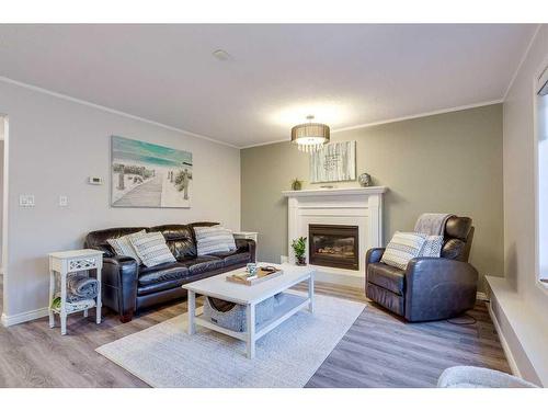 25 Dumas Crescent, Red Deer, AB - Indoor Photo Showing Living Room With Fireplace