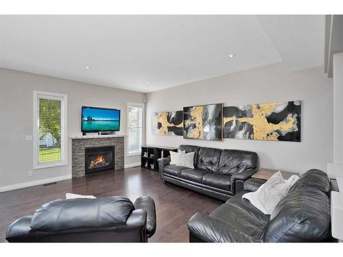 66 Traptow Close, Red Deer, AB - Indoor Photo Showing Living Room With Fireplace