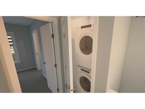 104-285 Chelsea Court, Chestermere, AB - Indoor Photo Showing Laundry Room