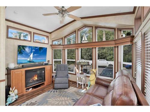 140-10032 Township Road 422, Rural Ponoka County, AB - Indoor Photo Showing Living Room With Fireplace