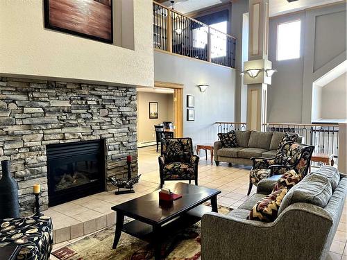 118-4805 45 Street, Red Deer, AB - Indoor Photo Showing Living Room With Fireplace