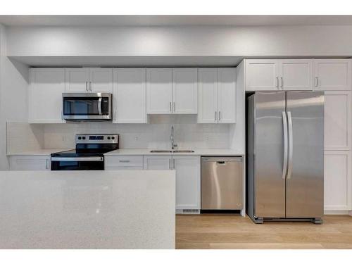 8494 19 Avenue Se, Calgary, AB - Indoor Photo Showing Kitchen With Double Sink