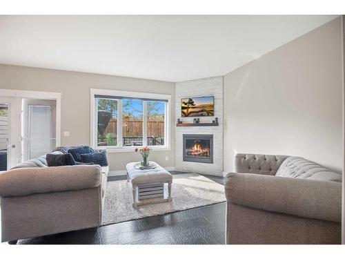 6505 58 Avenue, Innisfail, AB - Indoor Photo Showing Living Room With Fireplace