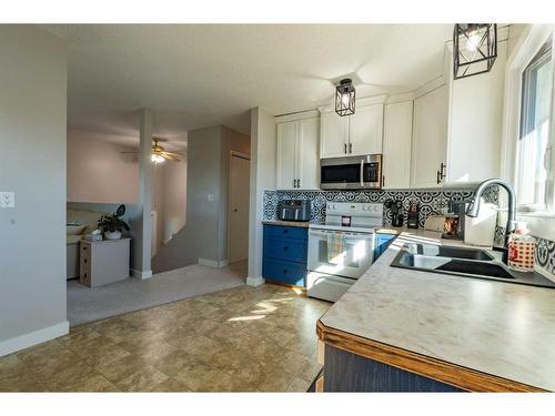 4205 63 Street, Stettler, AB - Indoor Photo Showing Kitchen With Double Sink