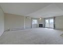 404-5601 Kerry Wood Drive, Red Deer, AB  - Indoor Photo Showing Other Room With Fireplace 