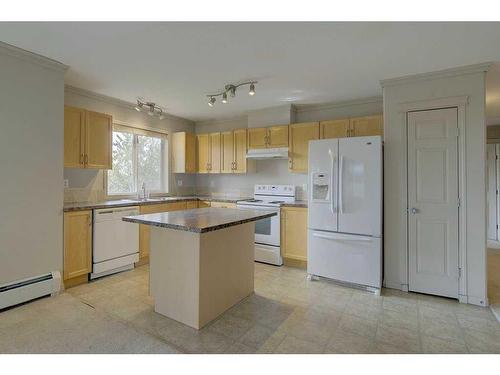 404-5601 Kerry Wood Drive, Red Deer, AB - Indoor Photo Showing Kitchen With Double Sink