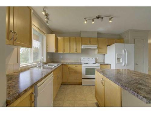 404-5601 Kerry Wood Drive, Red Deer, AB - Indoor Photo Showing Kitchen With Double Sink