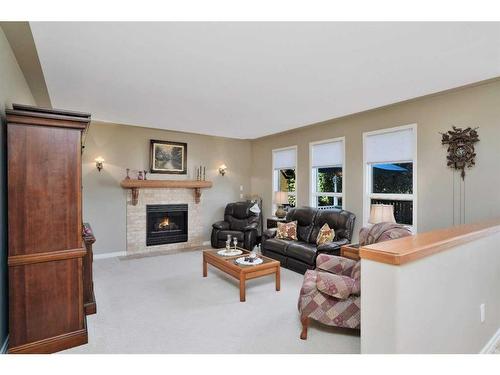 6406 55 Avenue, Ponoka, AB - Indoor Photo Showing Living Room With Fireplace