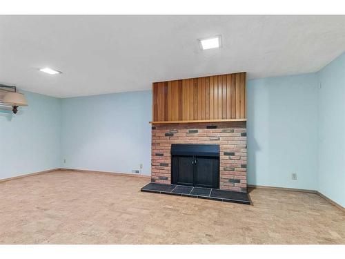 4221 33 Street, Red Deer, AB - Indoor Photo Showing Other Room With Fireplace