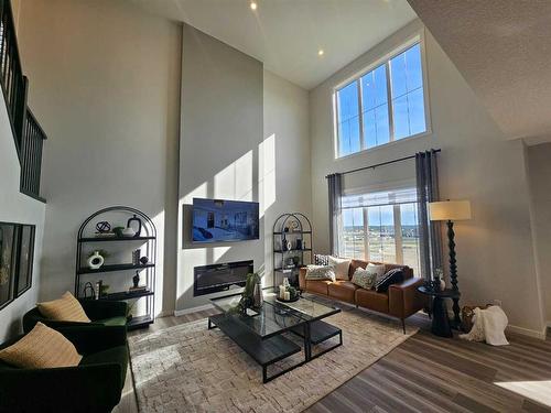 76 Key Cove Sw, Airdrie, AB - Indoor With Fireplace