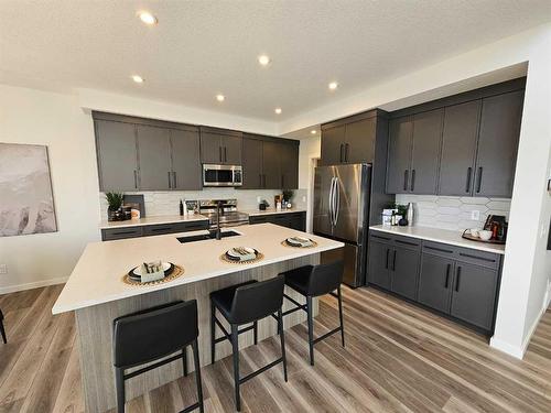 76 Key Cove Sw, Airdrie, AB - Indoor Photo Showing Kitchen With Upgraded Kitchen