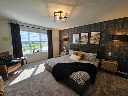 76 Key Cove Sw, Airdrie, AB - Indoor Photo Showing Bedroom