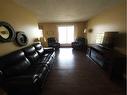 201-49 Bennett Street, Red Deer, AB  - Indoor Photo Showing Living Room 