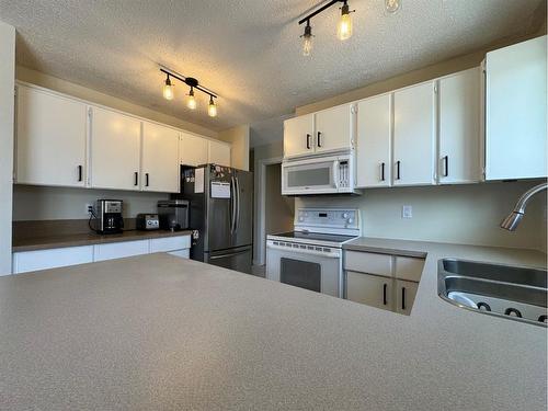 4309 75 Street, Camrose, AB - Indoor Photo Showing Kitchen With Double Sink