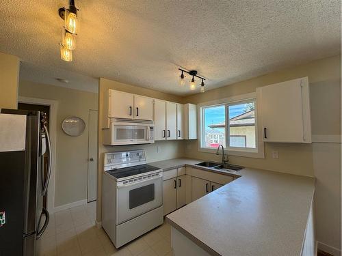 4309 75 Street, Camrose, AB - Indoor Photo Showing Kitchen With Double Sink