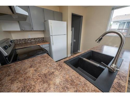 46 Grant Street, Red Deer, AB - Indoor Photo Showing Kitchen With Double Sink