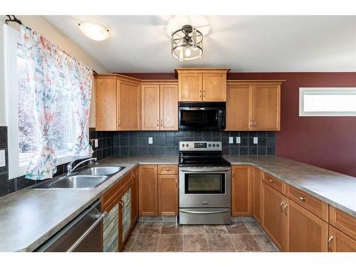 165 Kelloway Crescent, Red Deer, AB - Indoor Photo Showing Kitchen With Double Sink