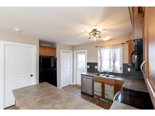 165 Kelloway Crescent, Red Deer, AB - Indoor Photo Showing Kitchen With Double Sink