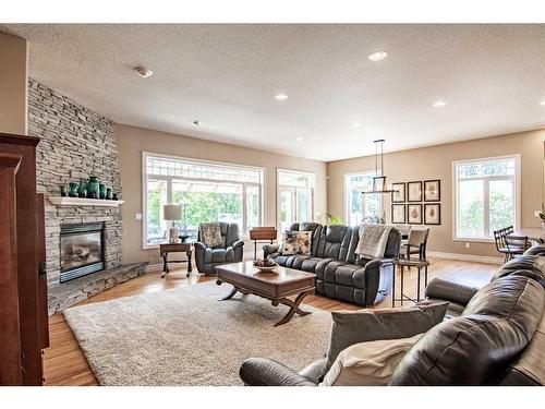 6240 Cronquist Drive, Red Deer, AB - Indoor Photo Showing Living Room With Fireplace