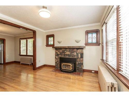 4754 55 Street, Red Deer, AB - Indoor Photo Showing Living Room With Fireplace