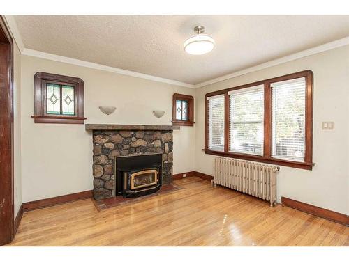 4754 55 Street, Red Deer, AB - Indoor Photo Showing Living Room With Fireplace