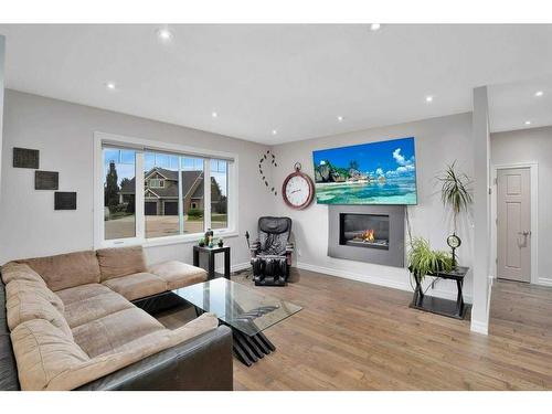 10 Henner'S Outlook, Lacombe, AB - Indoor Photo Showing Living Room With Fireplace