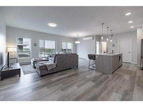 1201-220 Seton Grove Se, Calgary, AB - Indoor Photo Showing Living Room