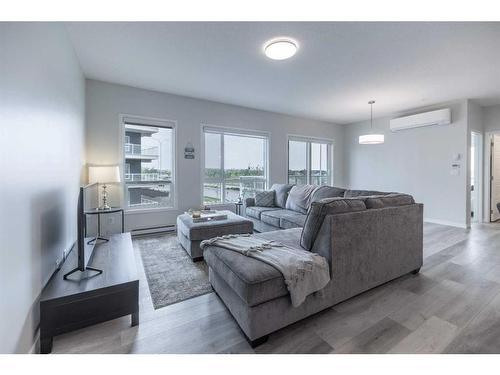 1201-220 Seton Grove Se, Calgary, AB - Indoor Photo Showing Living Room