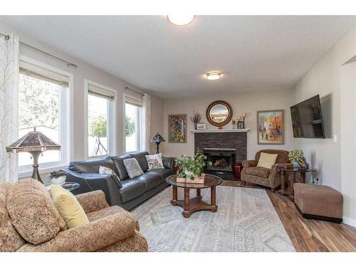 40 Alton Close, Red Deer, AB - Indoor Photo Showing Living Room With Fireplace