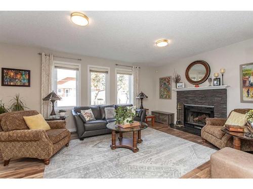 40 Alton Close, Red Deer, AB - Indoor Photo Showing Living Room With Fireplace