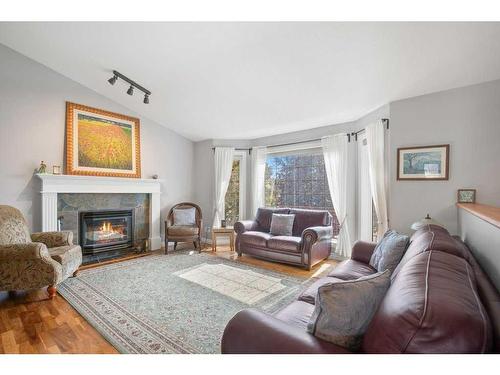 30 Abraham Close, Red Deer, AB - Indoor Photo Showing Living Room With Fireplace