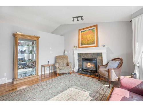 30 Abraham Close, Red Deer, AB - Indoor Photo Showing Living Room With Fireplace