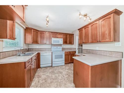 23 Stirling Close, Red Deer, AB - Indoor Photo Showing Kitchen With Double Sink