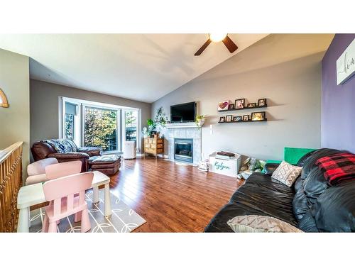 209 Strathford Bay, Strathmore, AB - Indoor Photo Showing Living Room With Fireplace