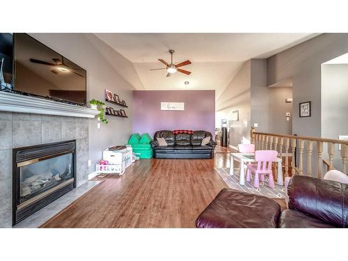 209 Strathford Bay, Strathmore, AB - Indoor Photo Showing Living Room With Fireplace