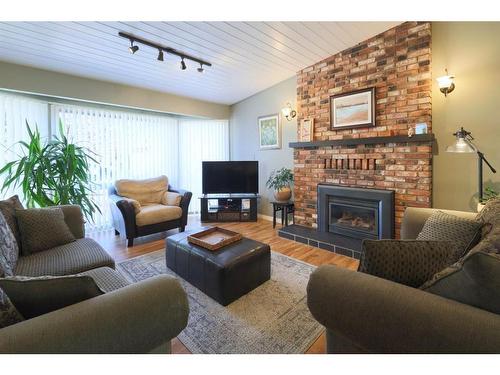 3905 67 Street, Camrose, AB - Indoor Photo Showing Living Room With Fireplace