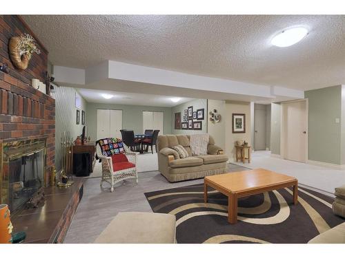 3905 67 Street, Camrose, AB - Indoor Photo Showing Living Room With Fireplace