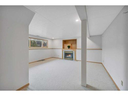 88 Dixon Crescent, Red Deer, AB - Indoor Photo Showing Other Room With Fireplace