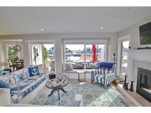 308 Marina Bay Place, Sylvan Lake, AB - Indoor Photo Showing Living Room With Fireplace