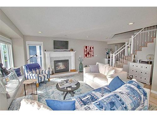 308 Marina Bay Place, Sylvan Lake, AB - Indoor Photo Showing Living Room With Fireplace