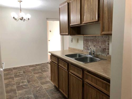 103-35 Bennett Street, Red Deer, AB - Indoor Photo Showing Kitchen With Double Sink