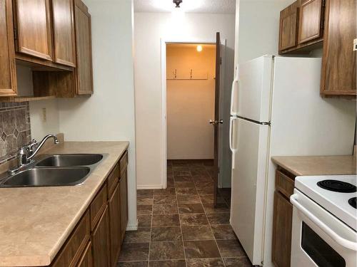 103-35 Bennett Street, Red Deer, AB - Indoor Photo Showing Kitchen With Double Sink