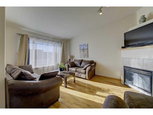 120 Lancaster Drive, Red Deer, AB - Indoor Photo Showing Living Room With Fireplace